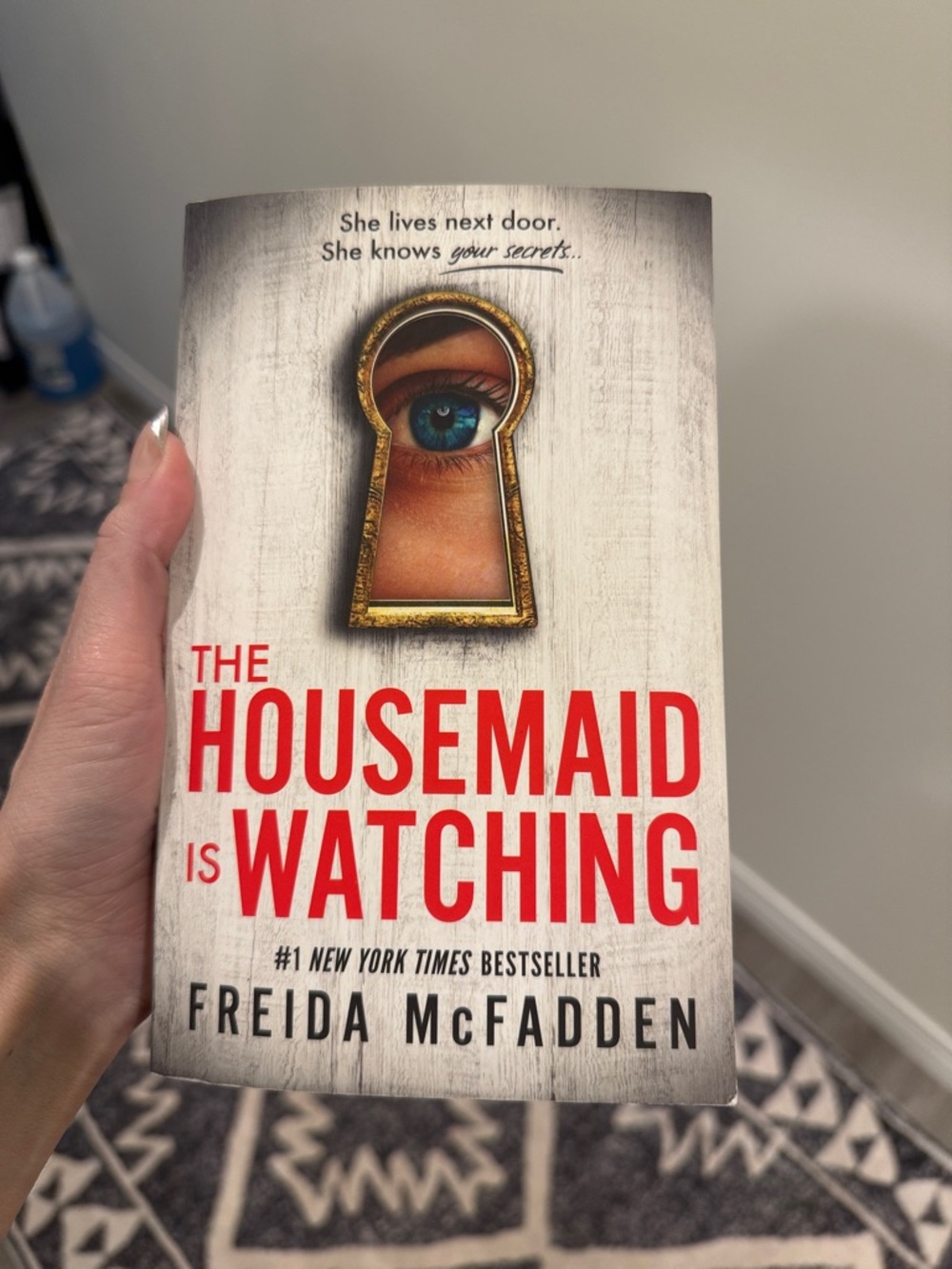 The Housemaid Is Watching — Thriller Novel in Red & White Cover